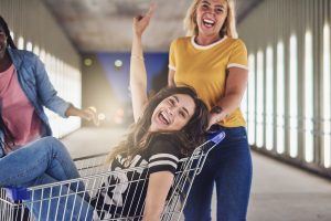 photodune vLfRs0HD girlfriends playing with a shopping cart together at night xl